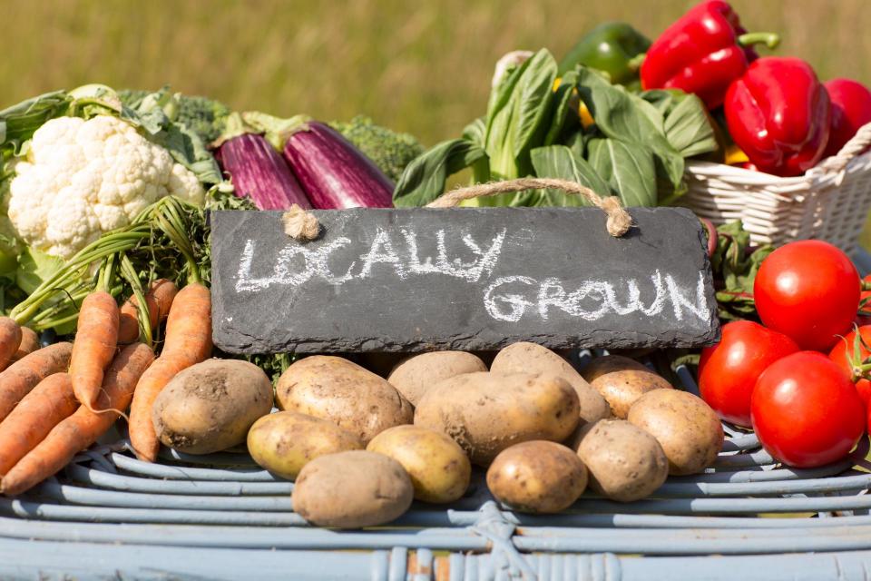 vegetables with locally grown sign